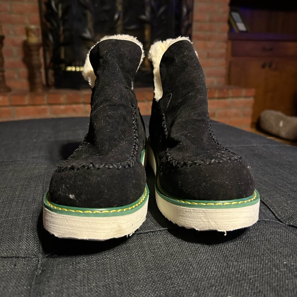 Cozy Black Ankle Boots with cream fur and small green along the stitching.  Neve